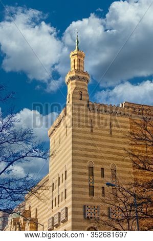A Brick Building In The Moroccon Style Under A Clear Blue Sky