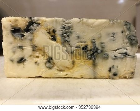 Gorgonzola Cheese Close Up. Veined Italian Blue Cheese. Mold Made With Penicillum Spores. Cooking De