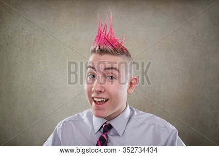 Smiling teen with a pink mohawk haircut