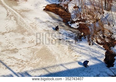 Kirov, Russia - March 23, 2019: Fisherman On The Ice Of The River On A Sunny Spring Day. Top View Of