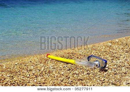 Maske på stranden