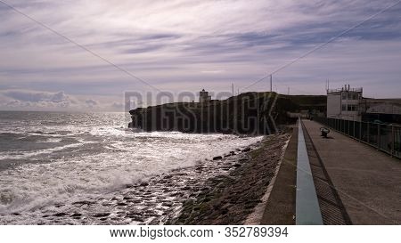 Dramatic Seascape With Heavy Clouds In Dunmore East Harbour,county Waterford,ireland.