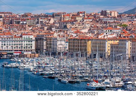 Aerial View Of Old Vieux Port On Sunny Day In The Historical City Center Of Marseilles, France
