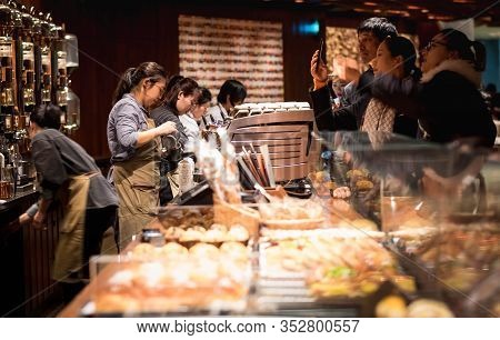 Shanghai, China - January 11, 2020: A Starbucks Barista Making Coffee For Their Customer At The Star