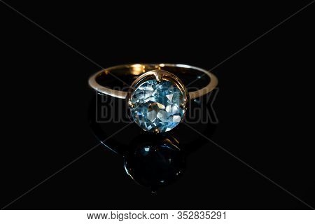 Beautiful Old Golden Ring With Blue Gemstone Isolated On White Background