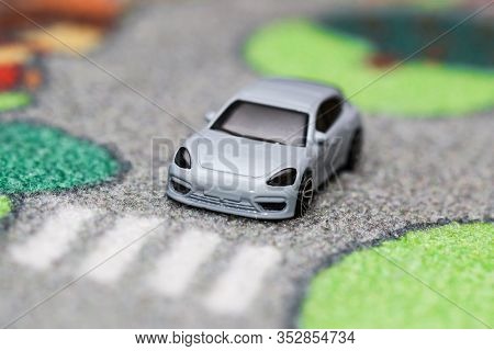 Toy Car Has Stopped In Front Of Crosswalk On Car Town Carpet Street