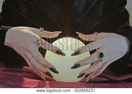 Crystal Ball And Fortune Teller Hands. Divination Concept. The Spiritual Seance. Future Reading.