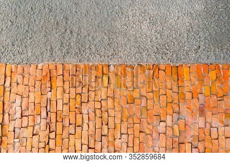Decorative Fragment Of Building Wall Made Of Orange Smalt Pieces. Mosaic Geometric Background For Yo