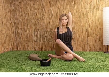 Sporty Woman Practicing Yoga, Doing Gomukasana Exercise, Cow Face Pose, Working Out, Wearing Sportsw