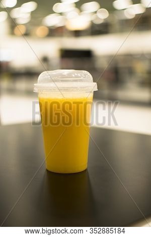 Orange Juice Isolated, Plastic Cup Of Fruit Juice On White Background
