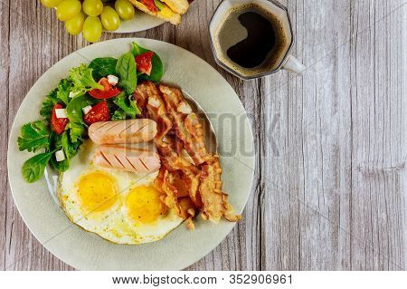 Coffee With Fried Eggs, Bacon, Franks And Salad Fpr Breakfast.