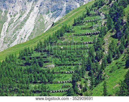 Protection Against Avalanches In The Liechtenstein Alps Mountain Range Or Wooden Fences As Protectio