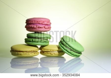 Five Colored Macaroons On The Wite Table