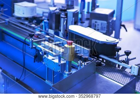 Pharmaceutical Industry. Production Line Machine Conveyor At Factory With Bottles.