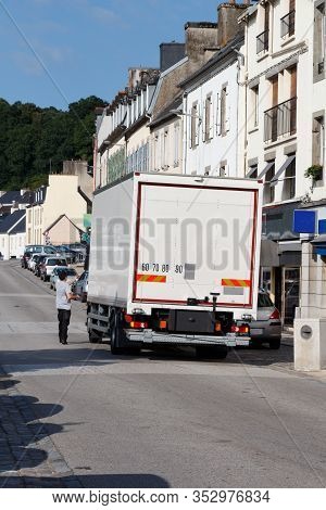 Truck Parks In A Street To Deliver Goods In A Shop In Chateaulin