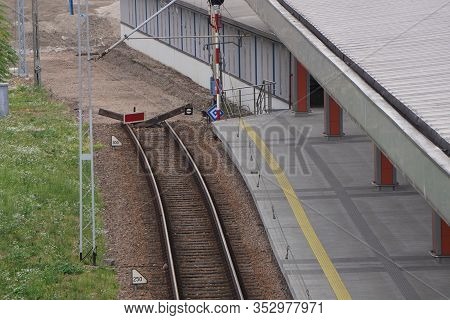 Railway Tracks For A Tram Or Train At The Platform In Europe On Sunny Day.