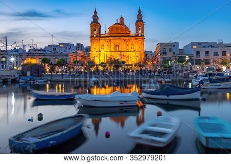 Valletta Harbour With Yachts And Fishing Boats, Msida Parish Church Of Saint Joseph At Sunset, Malta
