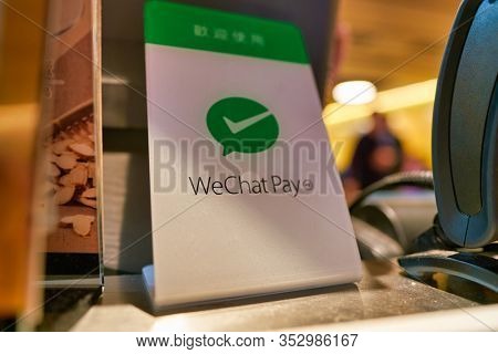 HONG KONG, CHINA - CIRCA JANUARY, 2019: close up shot of WeChat Pay payment services sign seen at Cafe De Coral in Hong Kong. WeChat Pay digital wallet service incorporated into WeChat.