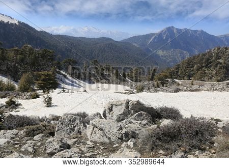 Sunny spring landscape in Turkish mountains. View from Tahtali Dagi mountain top on Likya Yolu famous tourist walkway in Turkey