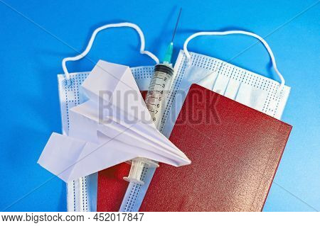 Ampoule With Vaccine And Syringe, Face Mask, Paper Airplane - The Concept Of New Rules For Tourism A