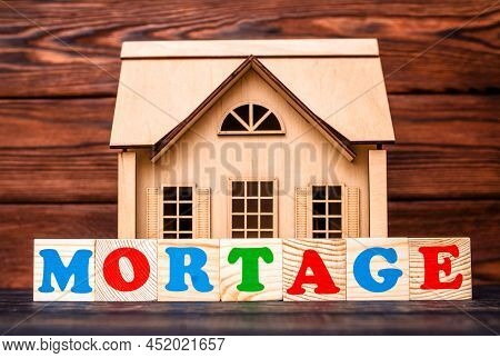 Wooden Home And Text On The Cubes Mortage