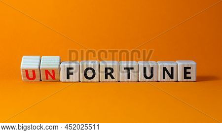 Fortune Or Unfortune Symbol. Turned Wooden Cubes And Changed The Concept Word Unfortune To Fortune. 
