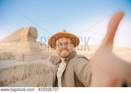 Travel Selfie Photo Man In Hat Background Pyramid Of Egyptian Giza And Sphinx, Sunset Cairo, Egyp