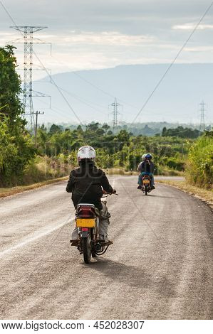 Motorcycle Travels On The National Highway T 16 From Salavan To Pakse, Laos. Asphalt Road On Bolaven