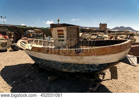 Cabo De Gata, Spain - September 04, 2020: Fishing Boats And Ships Stranded On The Beach Sand In The 