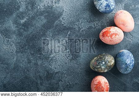 Easter Eggs. Dyed Easter Eggs With Marble Stone Effect Ref And Blue Color In Rustic Style On Dark St