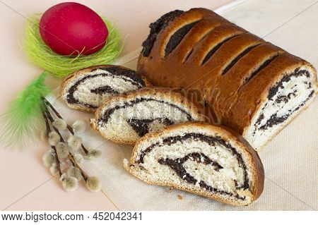Delicious Easter Roll With Poppy Seeds (makowiec) Whole And Sliced. Traditional Polish Festive Pastr