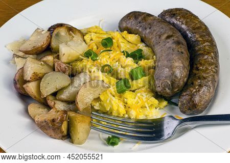 Scramble Eggs Top With Cheese And Green Onions With Sweet Italian Sausage