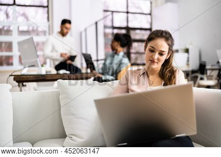 Young Diverse People Working In Coliving Space