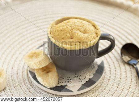 Homemade Portioned Banana Bread Mugcake In Small Mugs.