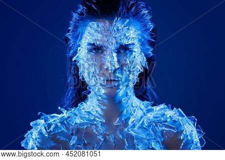 Female Face Covered With A Lot Small Pieces Of Glass Or Ice