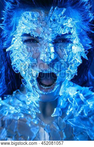 Female Face Covered With A Lot Small Pieces Of Glass Or Ice