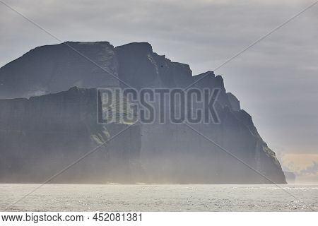 Faroe Islands Sunset Dramatic Coastline Landscape In Vagar Island. Seascape