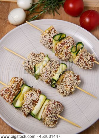 Raw Lamb Skewers With Zucchini Slices And Sesame Seeds, High Quality Photo