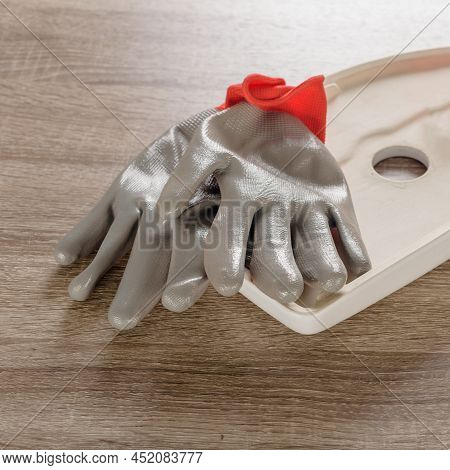 Professional Plumber Gloves And Tape Fum Lying On Toilet Lid