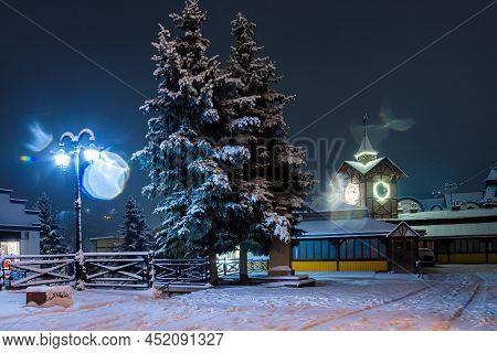 Detailed View Of An Ancient Wooden Town Hall With An Antique Clock. Famous Tourist Place And A Place