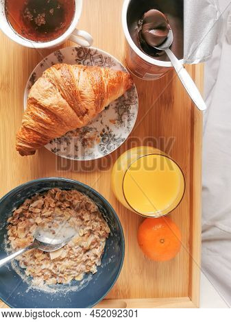 Healthy Food At Morning With A Bowl Of Muesli, Fresh Orange Juice And A Cup Of Chikory. And Unhealth