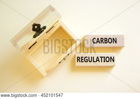 Carbon Regulation Symbol. Concept Words Carbon Regulation On Wooden Blocks On A Beautiful White Tabl
