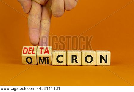 Covid-19 Omicron Or Deltacron Symbol. Doctor Turns Cubes And Changes The Word Omicron To Deltacron. 