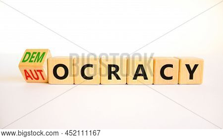Democracy Or Autocracy Symbol. Turned Wooden Cubes And Changed The Concept Word Autocracy To Democra