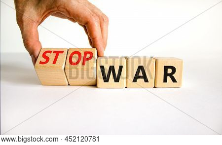 Stop War Symbol. Businessman Turns Cubes And Changes Concept Words War To Stop War. Beautiful White 