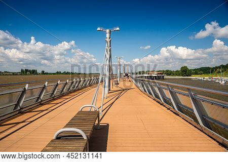 Plock, Poland, Europe - August 12, 2021. Pier Over River Vistula Ending By Molo Cafe Refreshment