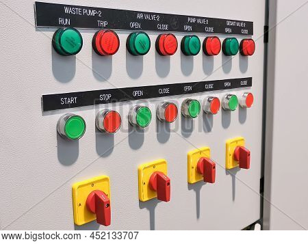 Close Up Image A Row Pilot Lamp, Push Button And Selector Switch Mount On Electrical Cabinet Door.