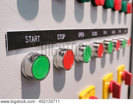 Close Up Image A Row Pilot Lamp, Push Button And Selector Switch Mount On Electrical Cabinet Door.