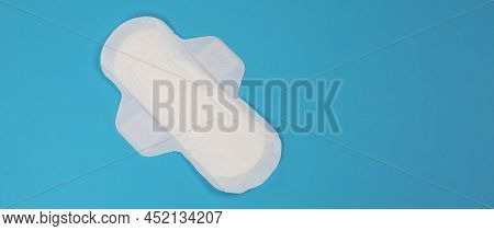 Woman Sanitary Napkins On Blue Background. Top View.