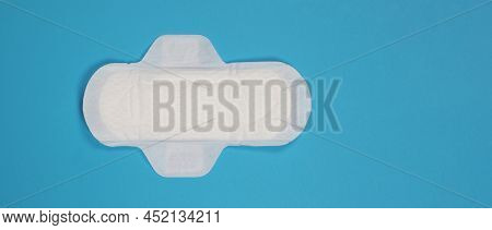 Woman Sanitary Napkins On Blue Background. Top View.